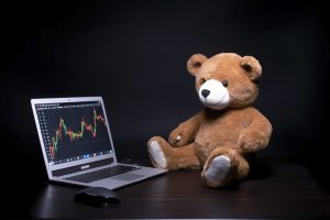 Cartoon bear playing laptop, generate ai